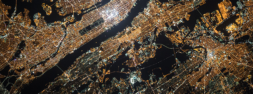 Aerial view of night time city lights